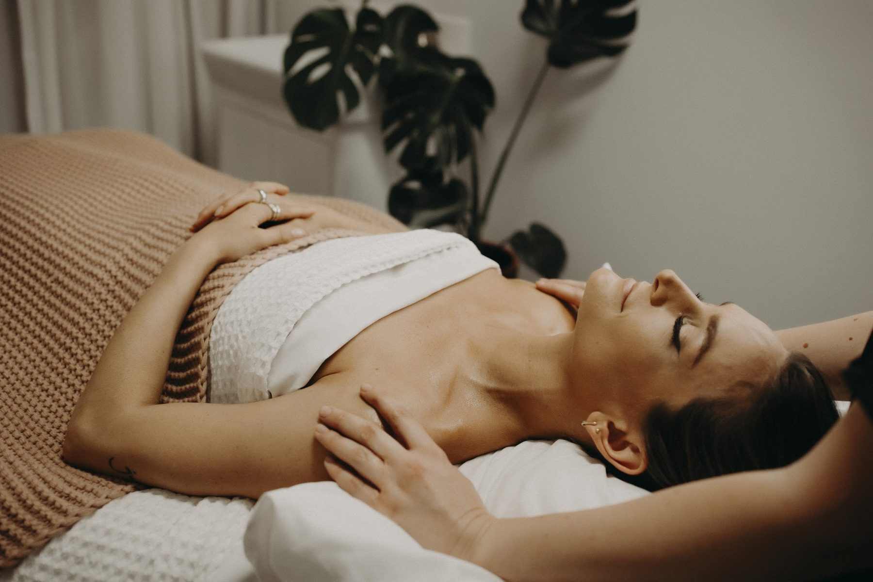 Client relaxing on the bed | Glow Skin & Spa, Baldivis